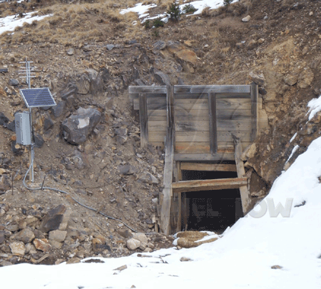 flow monitoring equipment at entrance to abandoned mine