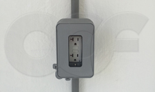 Leviton GFCI outlet with weather cover mounted in fiberglass equipment shelter