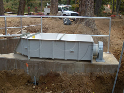 Fiberglass H Flume mounted on concrete slab above grade with stainless steel restraint