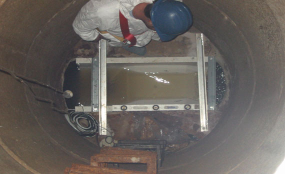 insert Palmer-Bowlus flume installed in a concrete manhole to meter wastewater