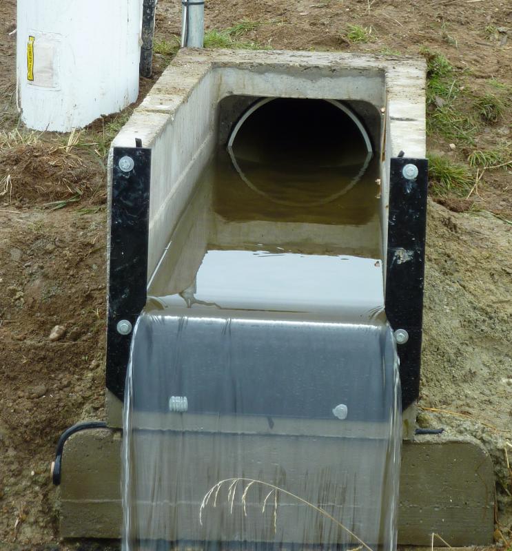 weir installed to measure end-of-pipe irrigation discharge flows