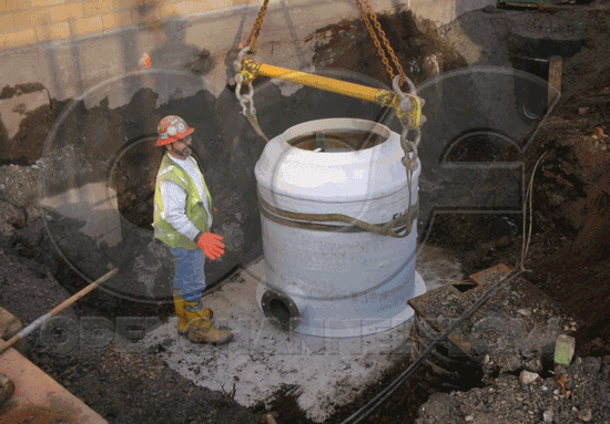 fiberglass metering manhole on a concrete mounting slab