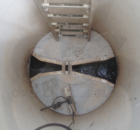 Plasti-fab fiberglass packaged metering manhole with concrete bench poured around a Parshall flume