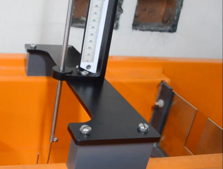 hook gage and vernier scale used to measure head in a bench top weir