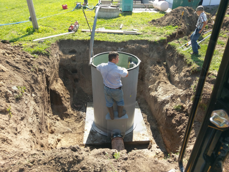 leveling a packaged metering manhole installation