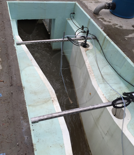 a fiberglass Parshall flume measuring wastewater at a WWTP headworks