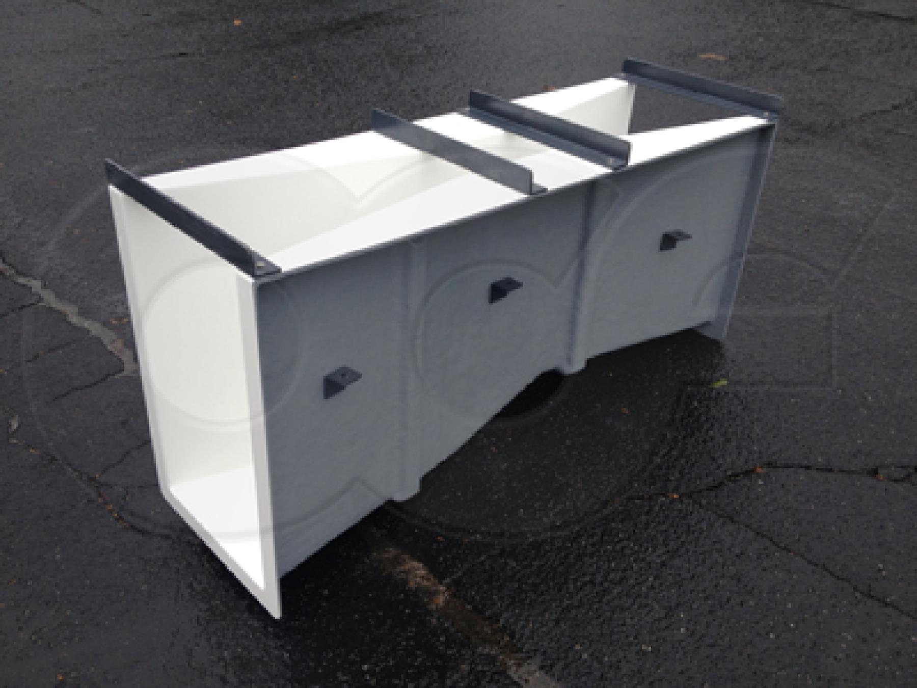 side view of a fiberglass 6-inch Parshall flume showing the drop through the flume - flow is from right to left