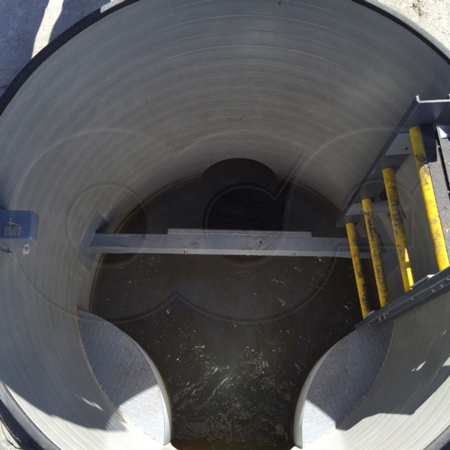 fiberglass energy absorbing manhole controlling high velocity flows