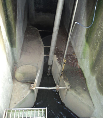 Parshall flume installed below grade in a concrete chamber