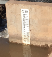 custom gauge measuring level at a rectangular weir