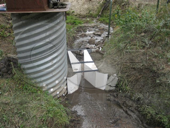 fiberglass wing walls directing flow into a cuthroat flume