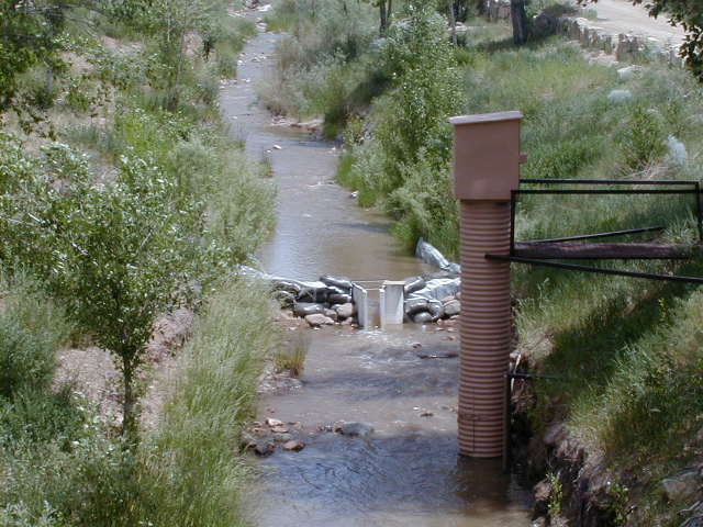 montana flume with stilling well measuring water flow in a channel