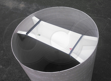 Trapezoidal flume with staged end adapters test fitted to a manhole section