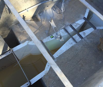 Near grade installation of a Parshall flume measuring industrial discharge