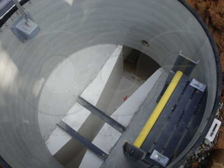 Light colored interior of Openchannelflow Packaged Metering Manhole with factory integrated Parshall flume after installation