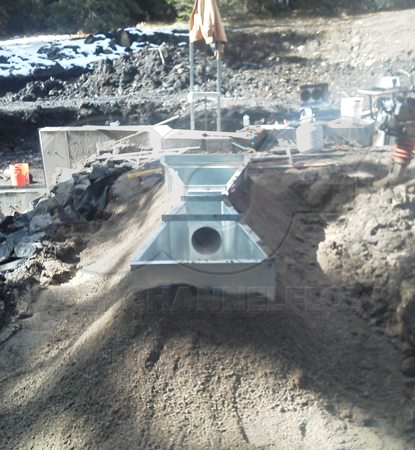 backfilling around a galvanized steel Parshall flume