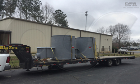 Openchannelflow fiberglass Parshall Flume Flow Monitoring Manholes loaded on a flatbed trailer