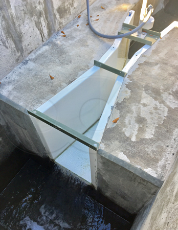 Free-spiilling discharge off the end of a Parshall flume measuring treated WWTP effluent
