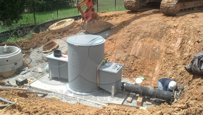 Packaged Metering Manhole with Parshall flume undergoing installation