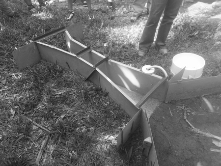 Parshall flume with flat inlet wing walls