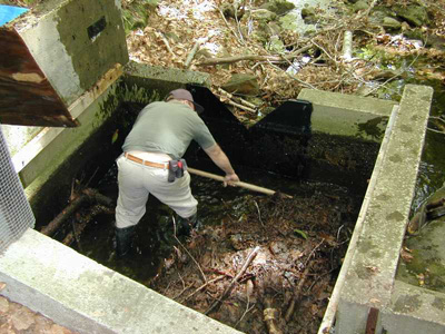 maintaining a thin-plate weir's pool