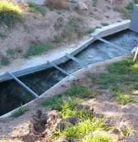flow in a submerged galvanized steel parshall flume measuring water rights flows